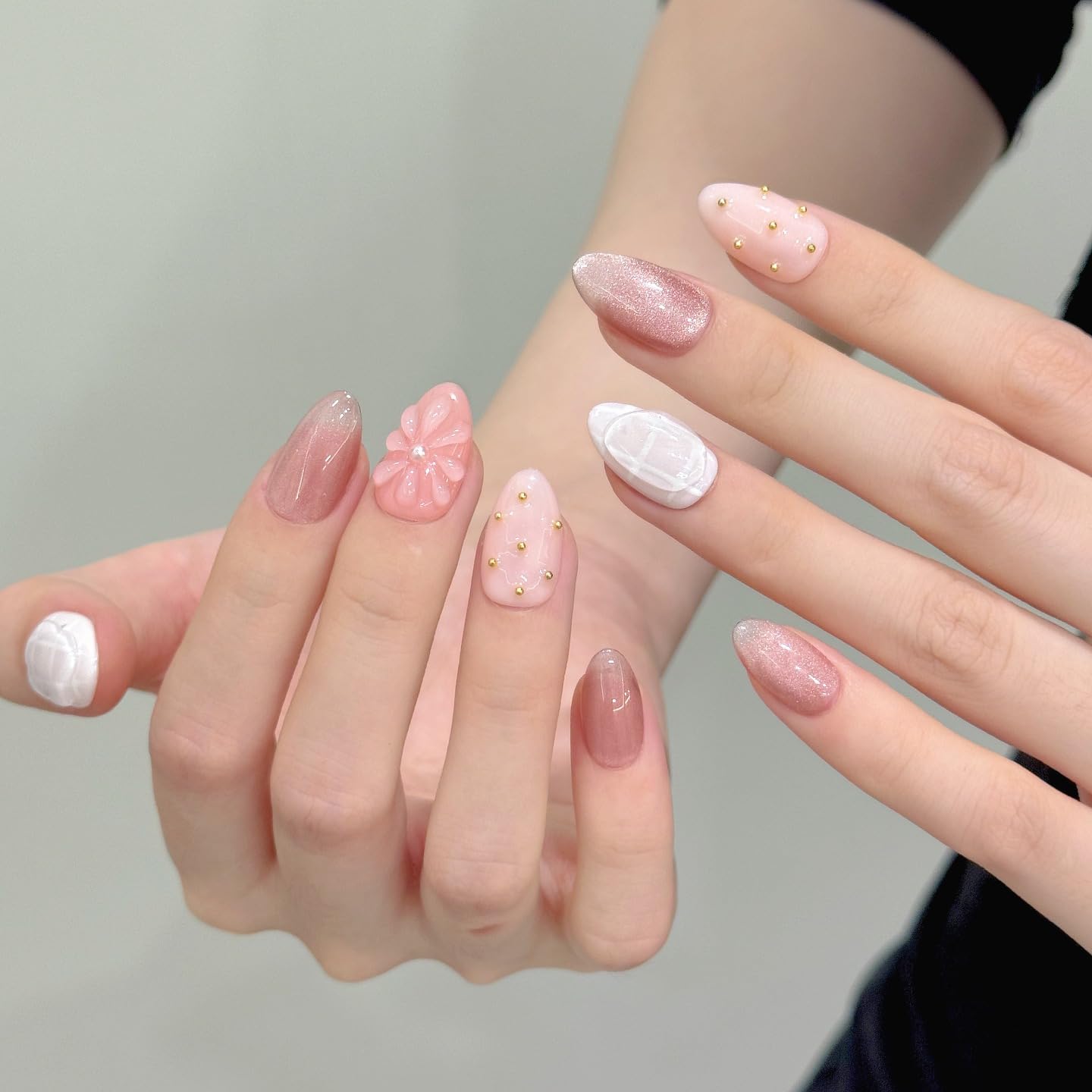 Tesytto Nude Pink Press on Nails Short Almond Cat Eye Fake Nails with 3D Sleek Water Drop Design Glossy Finish Glitter Full Cover Acrylic Nails (Ice Flowers,M)
