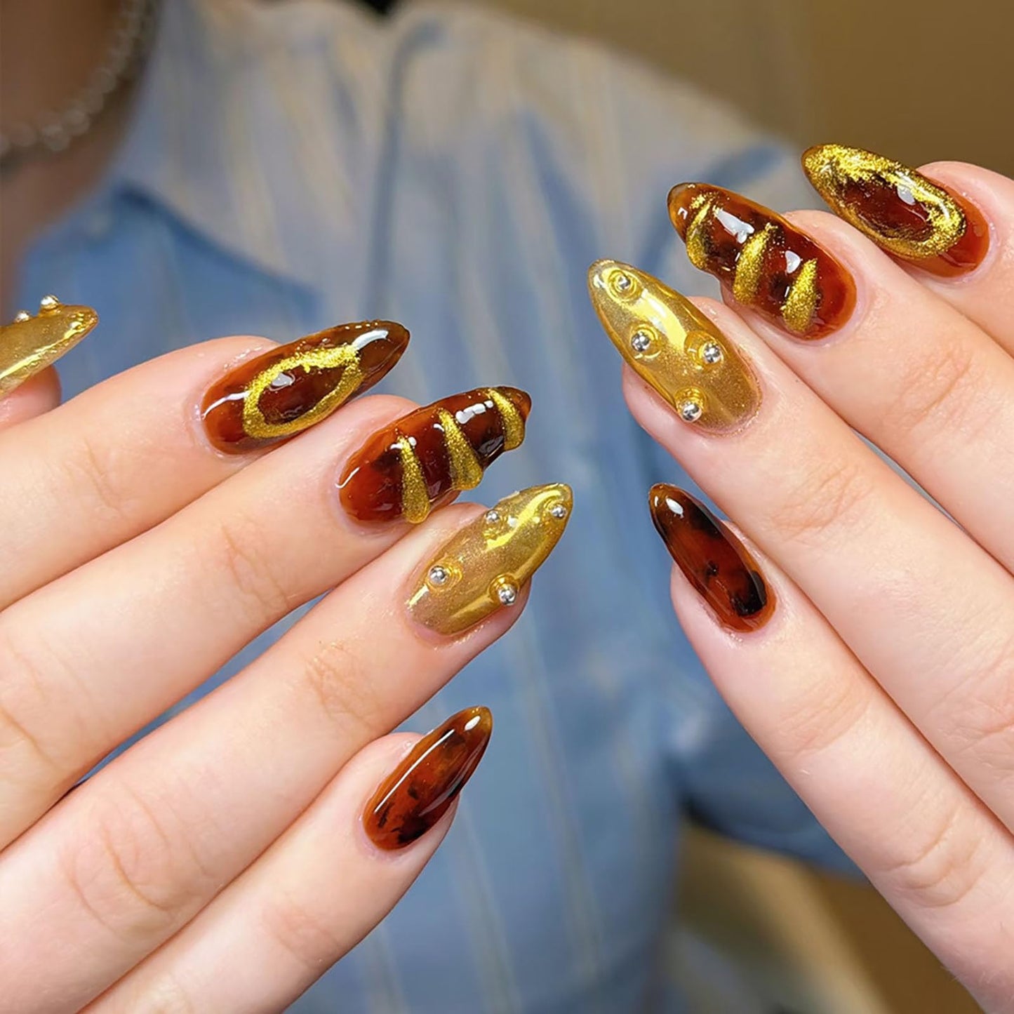 RUOKEXIN Almond Press on Nails Medium Fake Nails Gold False Nails with 3D Designs Spring Summer Nail Press ons Sparkly Artificial Nails for Women 24Pcs