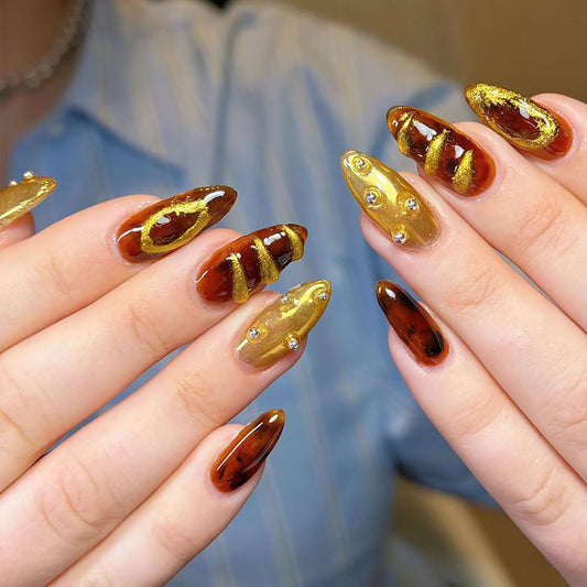 RUOKEXIN Almond Press on Nails Medium Fake Nails Gold False Nails with 3D Designs Spring Summer Nail Press ons Sparkly Artificial Nails for Women 24Pcs