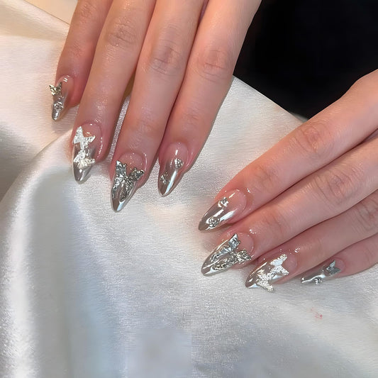 IMSOHOT Medium Almond Press on Nails Silver Chrome Gradient Fake Nails with Metal Butterfly Designs Glossy Full Cover Nude Acrylic Stick on Nails for Women Girls 24Pcs