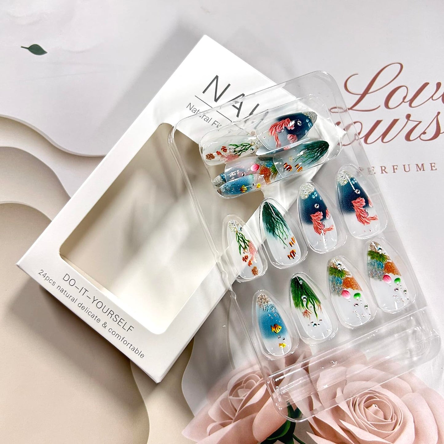 LOPMNGHT Press on Nails Long Length Almond Shaped Seaweed Fish Pattern Design Marine Life Fake Nail Full Cover Glossy Acrylic Artificial Fingernails Reusable French Tip Glue on Nails for Women 24Pcs