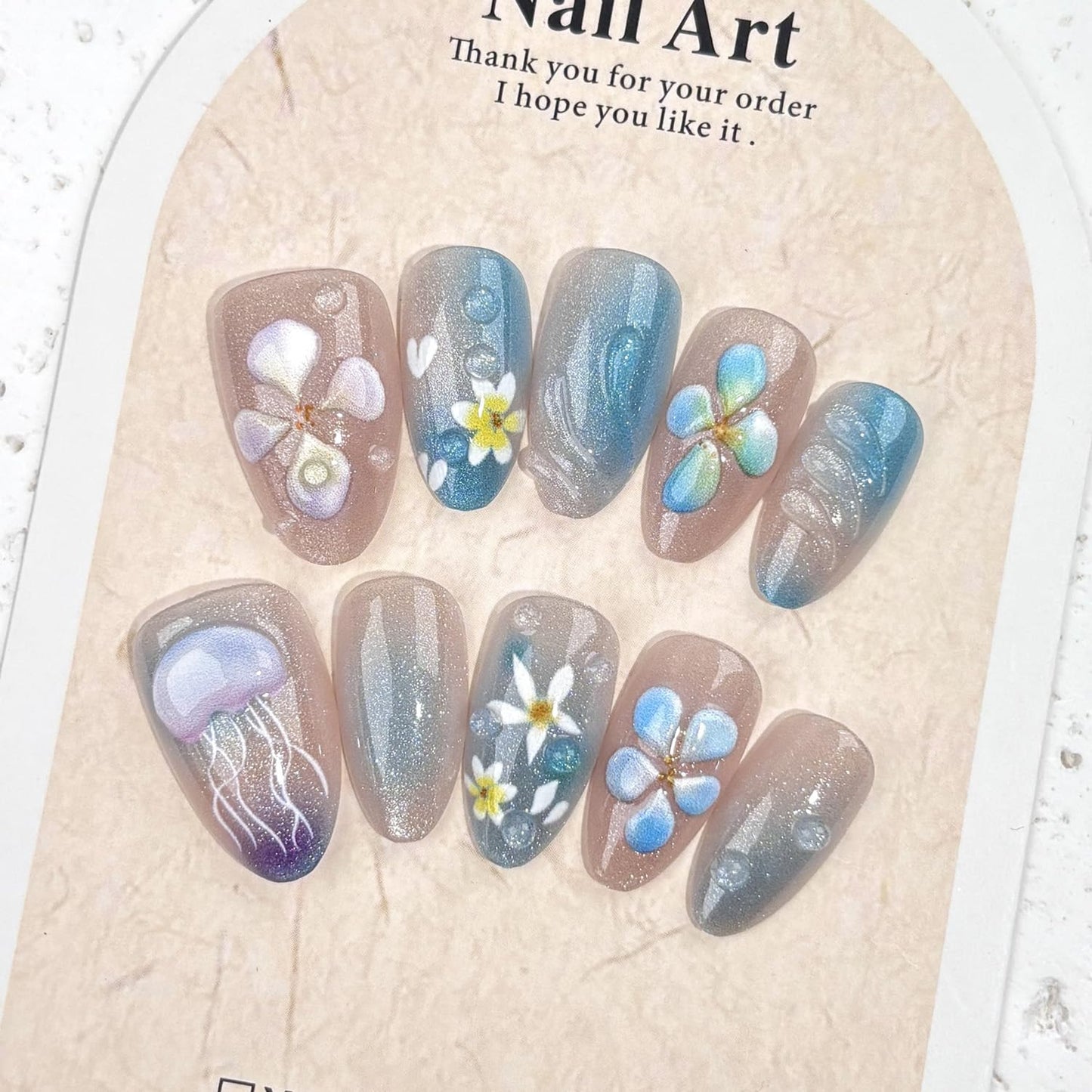 Medium Almond Press on Nails, Shimmer Blue Nude Fake Nails with 3D Jellyfish & Hand-Painted Flower Designs,Gradient Summer Ocean Themed False Nails with Glue Tabs 30Pcs Nail Kit for Women Manicure