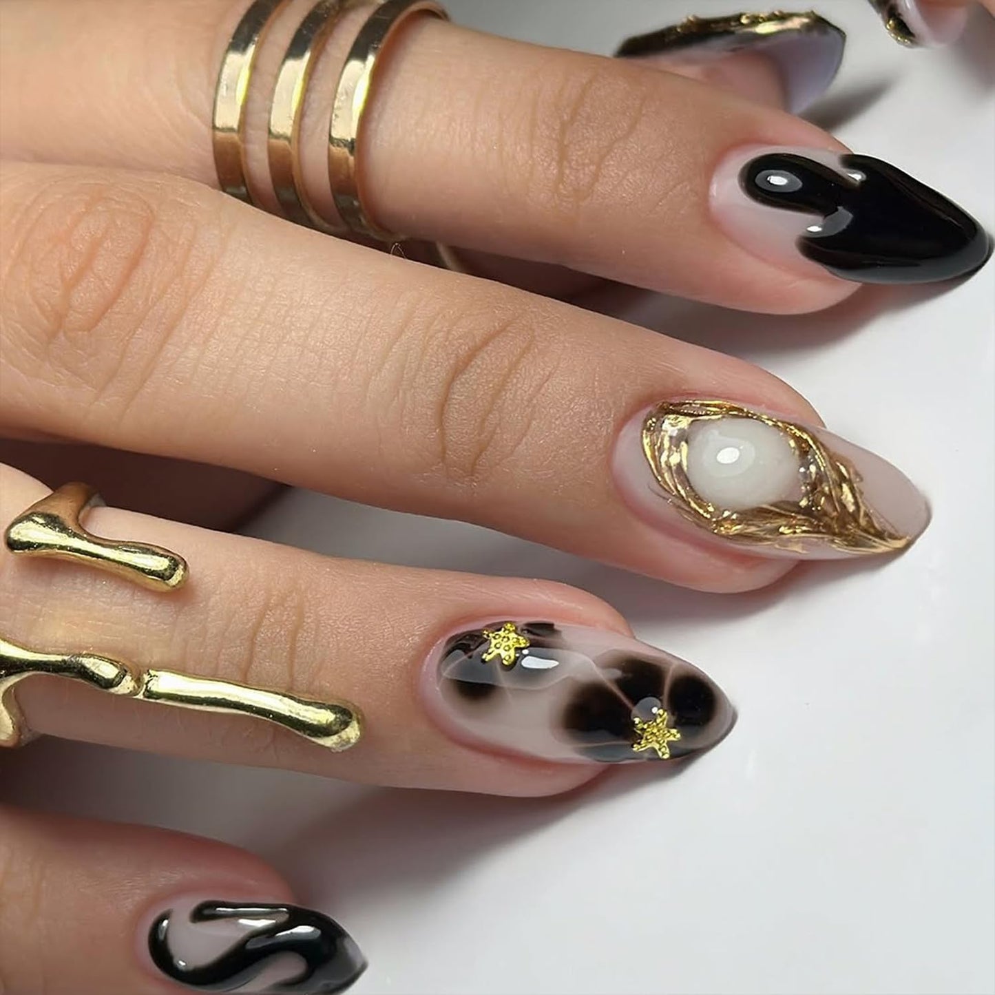 Black Press on Nails Short Almond Fake Nails with 3D Star Rhinestones Gold Stripes Designs Glossy Flowers Glue on Nail Reusable Artificial Acrylic Full Cover Stick on False Nail for Women 24Pcs