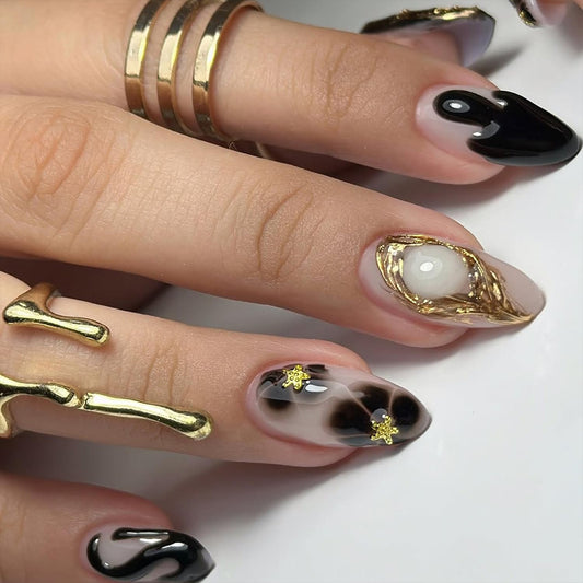 Black Press on Nails Short Almond Fake Nails with 3D Star Rhinestones Gold Stripes Designs Glossy Flowers Glue on Nail Reusable Artificial Acrylic Full Cover Stick on False Nail for Women 24Pcs