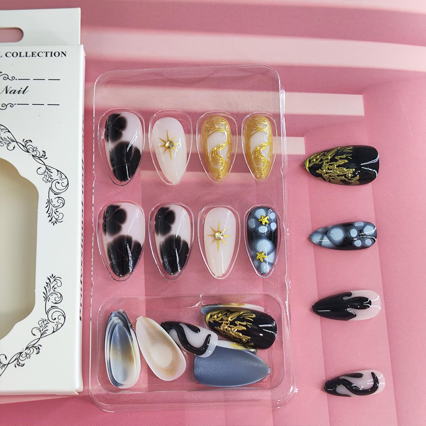 Black Press on Nails Short Almond Fake Nails with 3D Star Rhinestones Gold Stripes Designs Glossy Flowers Glue on Nail Reusable Artificial Acrylic Full Cover Stick on False Nail for Women 24Pcs