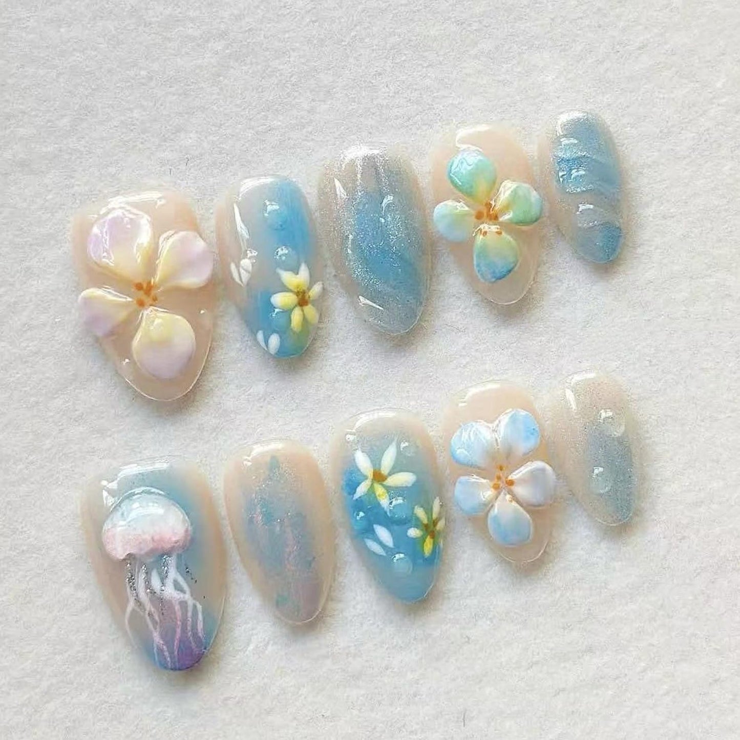 Medium Almond Press on Nails, Shimmer Blue Nude Fake Nails with 3D Jellyfish & Hand-Painted Flower Designs,Gradient Summer Ocean Themed False Nails with Glue Tabs 30Pcs Nail Kit for Women Manicure