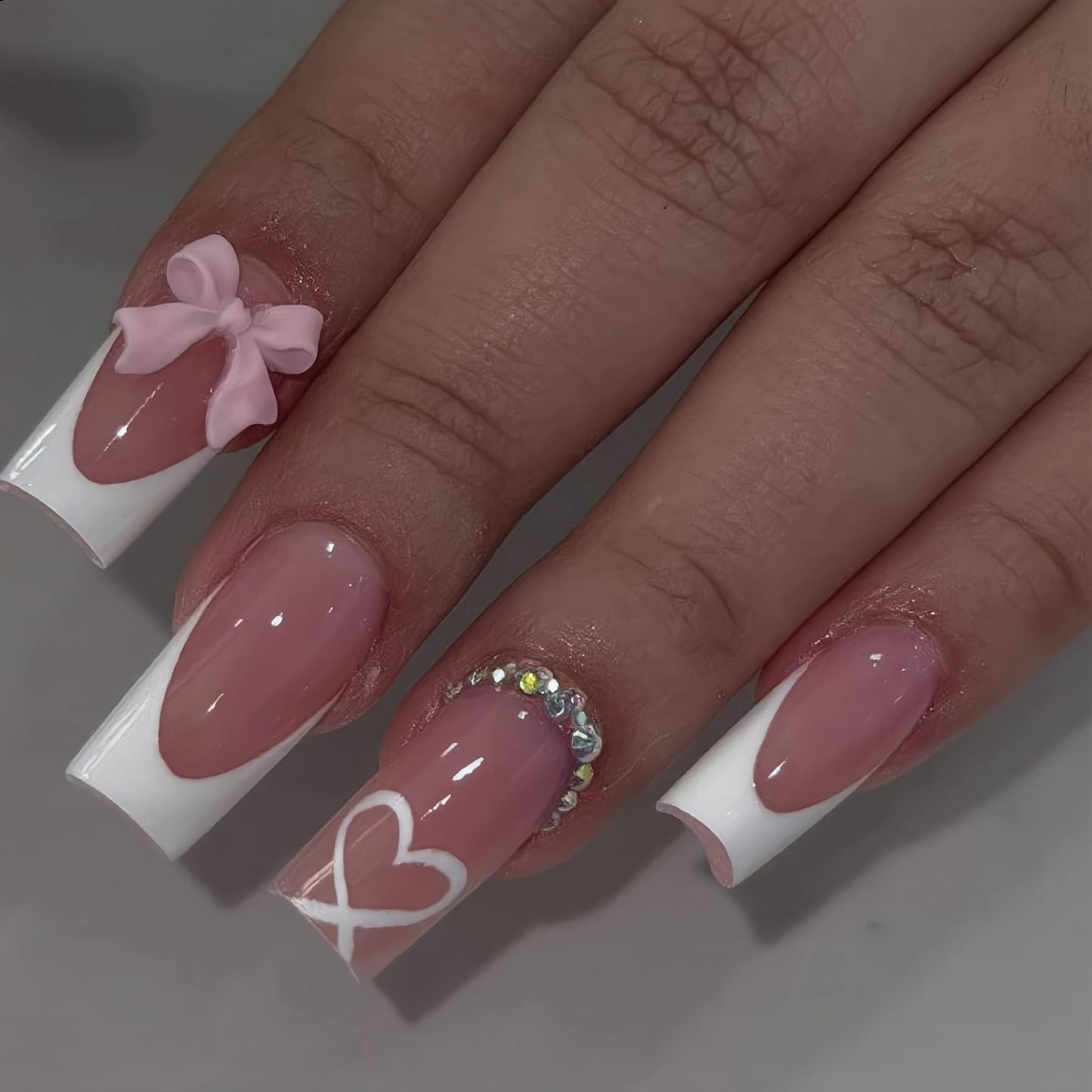 IEORGYIG French Press On Nails 3D Pink Butterfly Bow Heart White Medium-Length Trapezoidal Fake Nails，Reusable Adhesive 24Pcs Nail Kit For Women Manicure