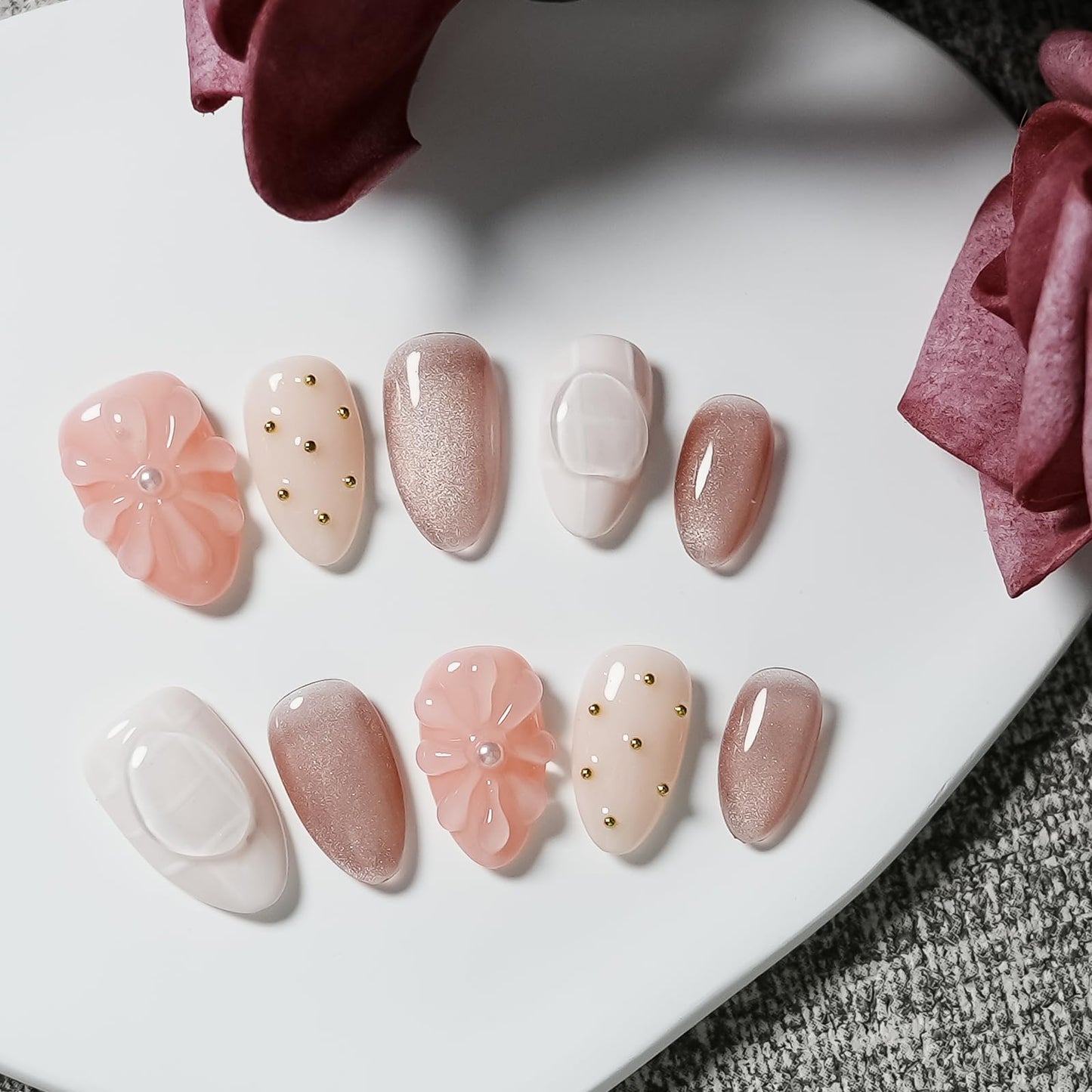 Tesytto Nude Pink Press on Nails Short Almond Cat Eye Fake Nails with 3D Sleek Water Drop Design Glossy Finish Glitter Full Cover Acrylic Nails (Ice Flowers,M)