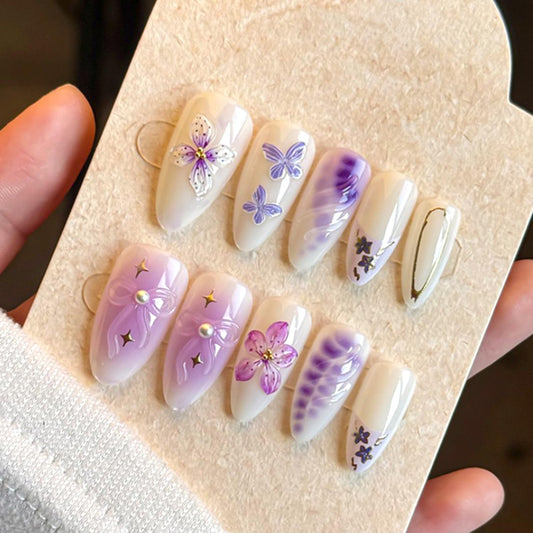 24Pcs Gradient Purple Flower Press on Nails Medium Almond Fake Nails with Floral Butterfly Star Designs Glossy French Nails Tip with 3D Floral & Pearl Nail Art Handmade False Nails for Women