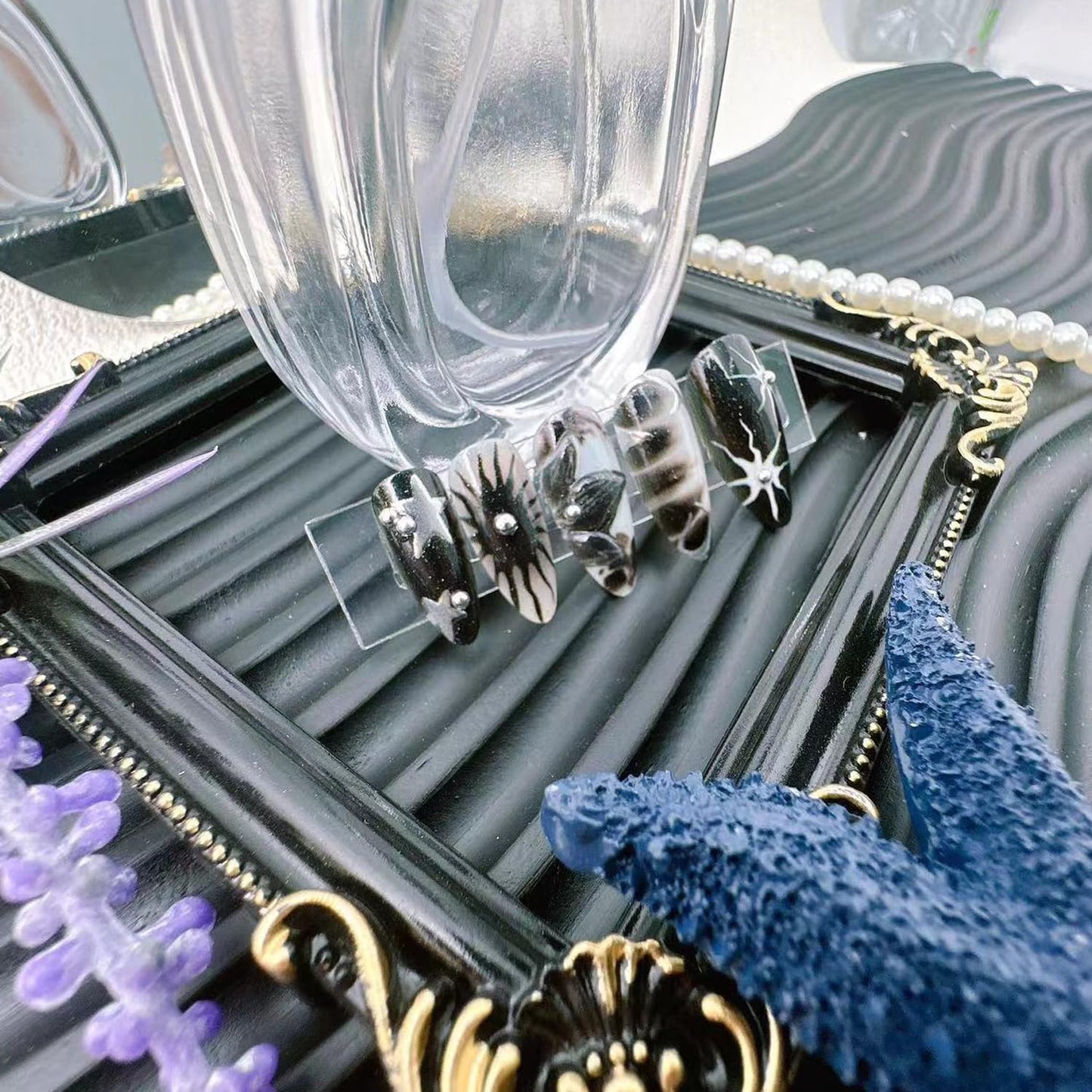 Y2K Gothic Press on Nails, Medium Almond 3D Black Silver Swirl Fake Nails with Embossed Flower & Star Designs, Metallic False Nails with Glue Tabs - 24Pcs Nail Kit for Women French Manicure