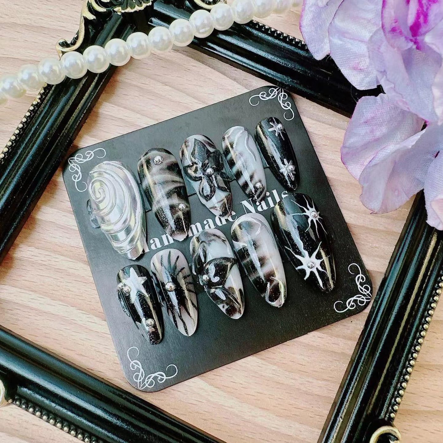 Y2K Gothic Press on Nails, Medium Almond 3D Black Silver Swirl Fake Nails with Embossed Flower & Star Designs, Metallic False Nails with Glue Tabs - 24Pcs Nail Kit for Women French Manicure