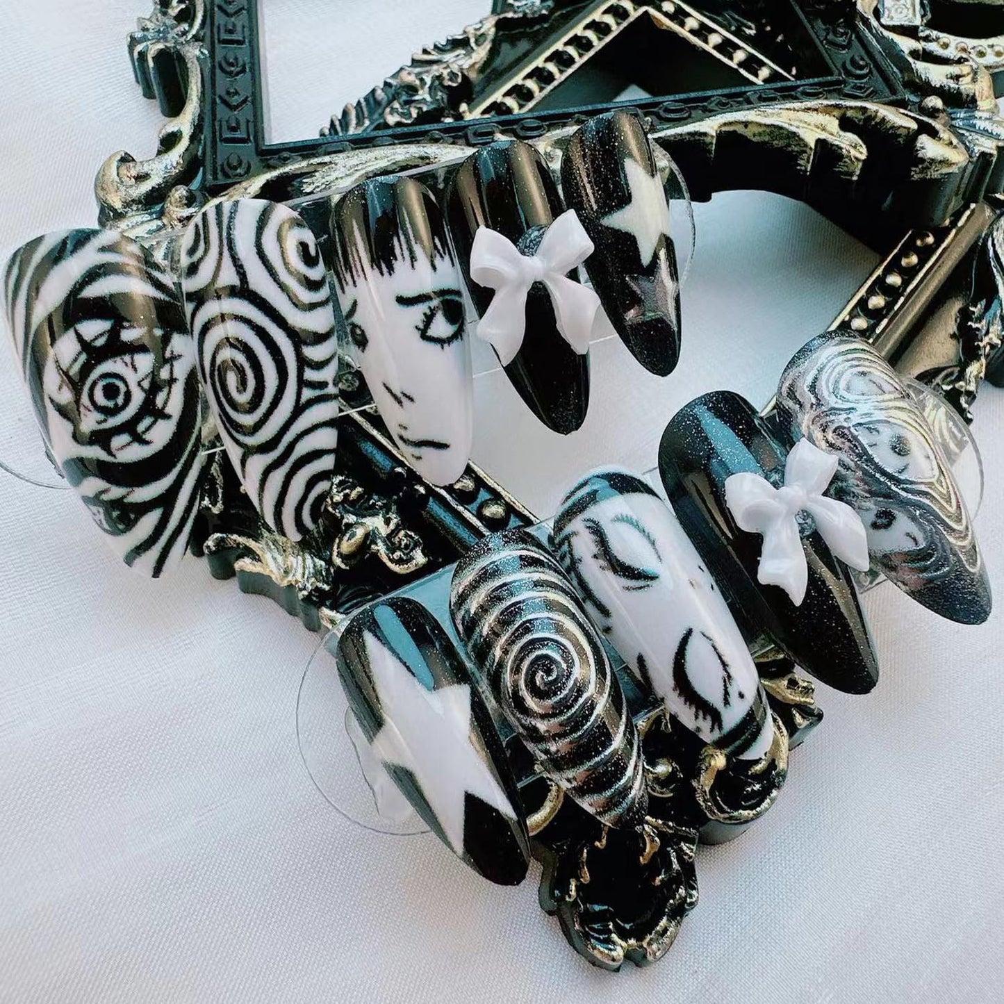 Gothic Press on Nails Medium Almond -Horror Black White False Nails with Eye Swirl 3D Bow Star Hand Painted, Spooky Punk Cartoon Anime Y2k Fake Nails with Glue Tabs for Women Halloween Cosplay 24Pcs