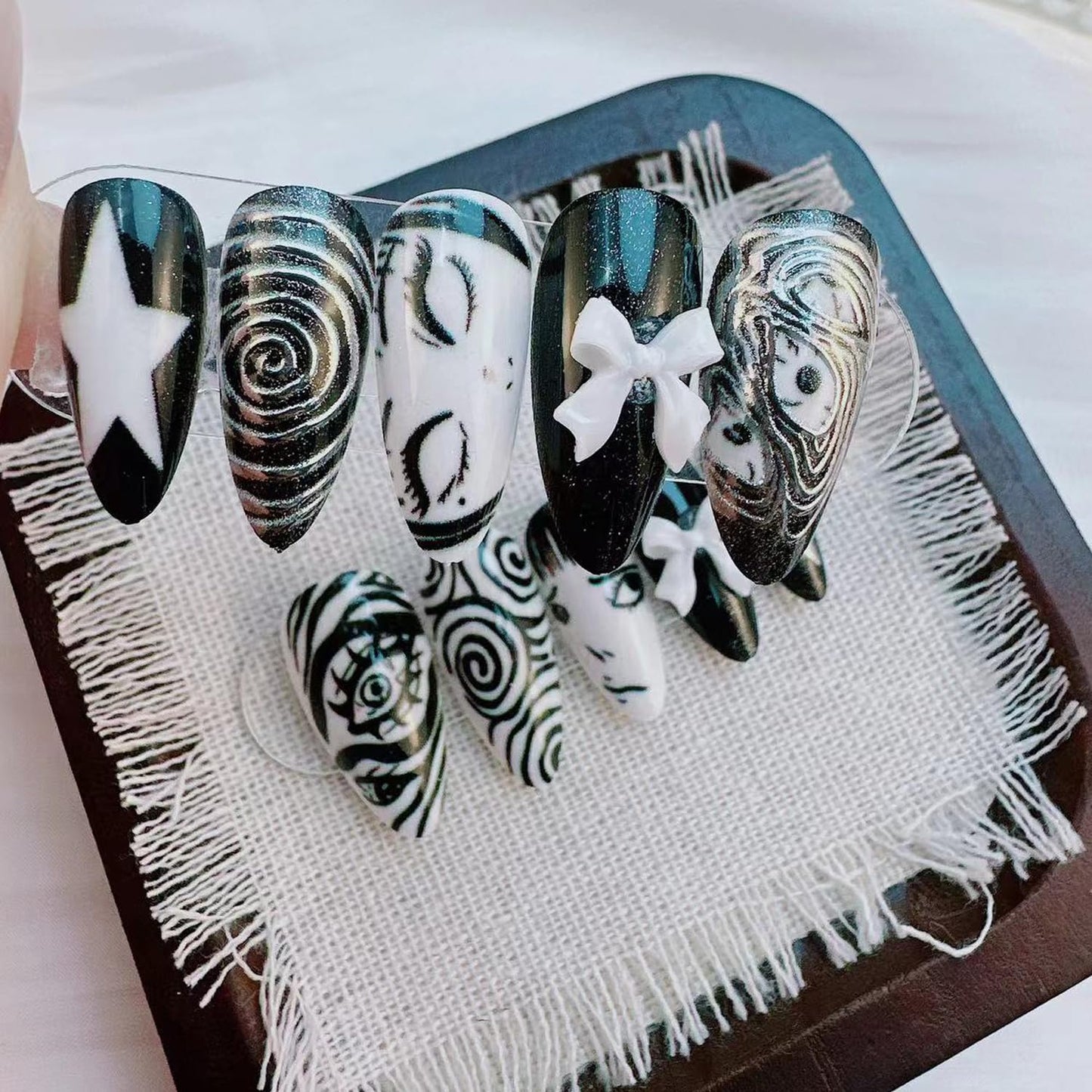 Gothic Press on Nails Medium Almond -Horror Black White False Nails with Eye Swirl 3D Bow Star Hand Painted, Spooky Punk Cartoon Anime Y2k Fake Nails with Glue Tabs for Women Halloween Cosplay 24Pcs