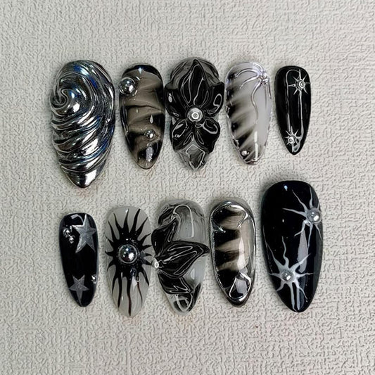Y2K Gothic Press on Nails, Medium Almond 3D Black Silver Swirl Fake Nails with Embossed Flower & Star Designs, Metallic False Nails with Glue Tabs - 24Pcs Nail Kit for Women French Manicure