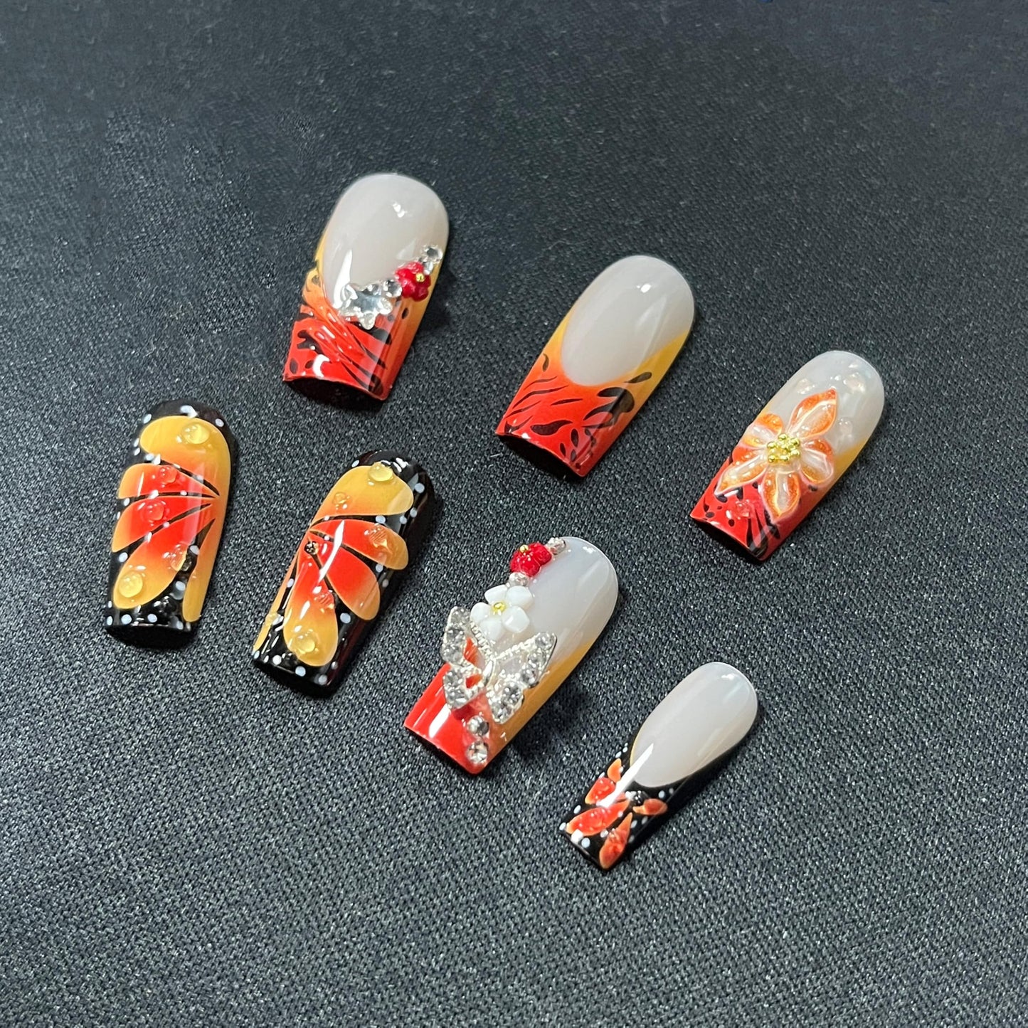 MERVF Press on Nails Long Square, Orange Black French Tip Fake Nails, 3D Flower Butterfly Glue ons Charms Acrylic Nail Ombre Design Glossy 24pcs